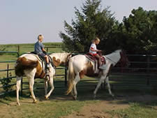 Kids riding Shadow and Susie